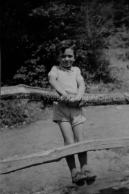 1934 Leaning on a fence