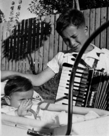With his accordion